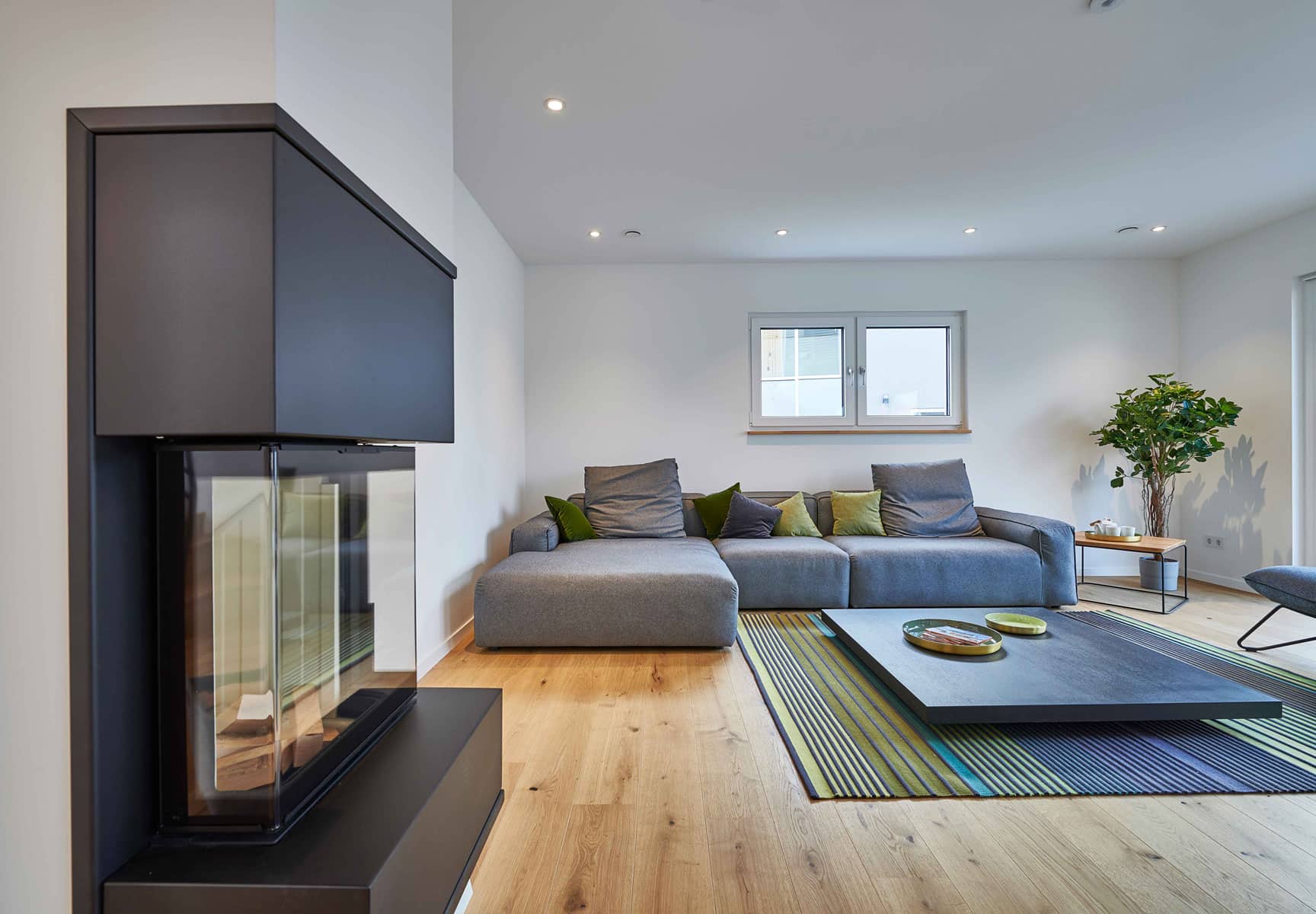 Wohnzimmer Musterhaus Günzburg von Fertighaus WEISS